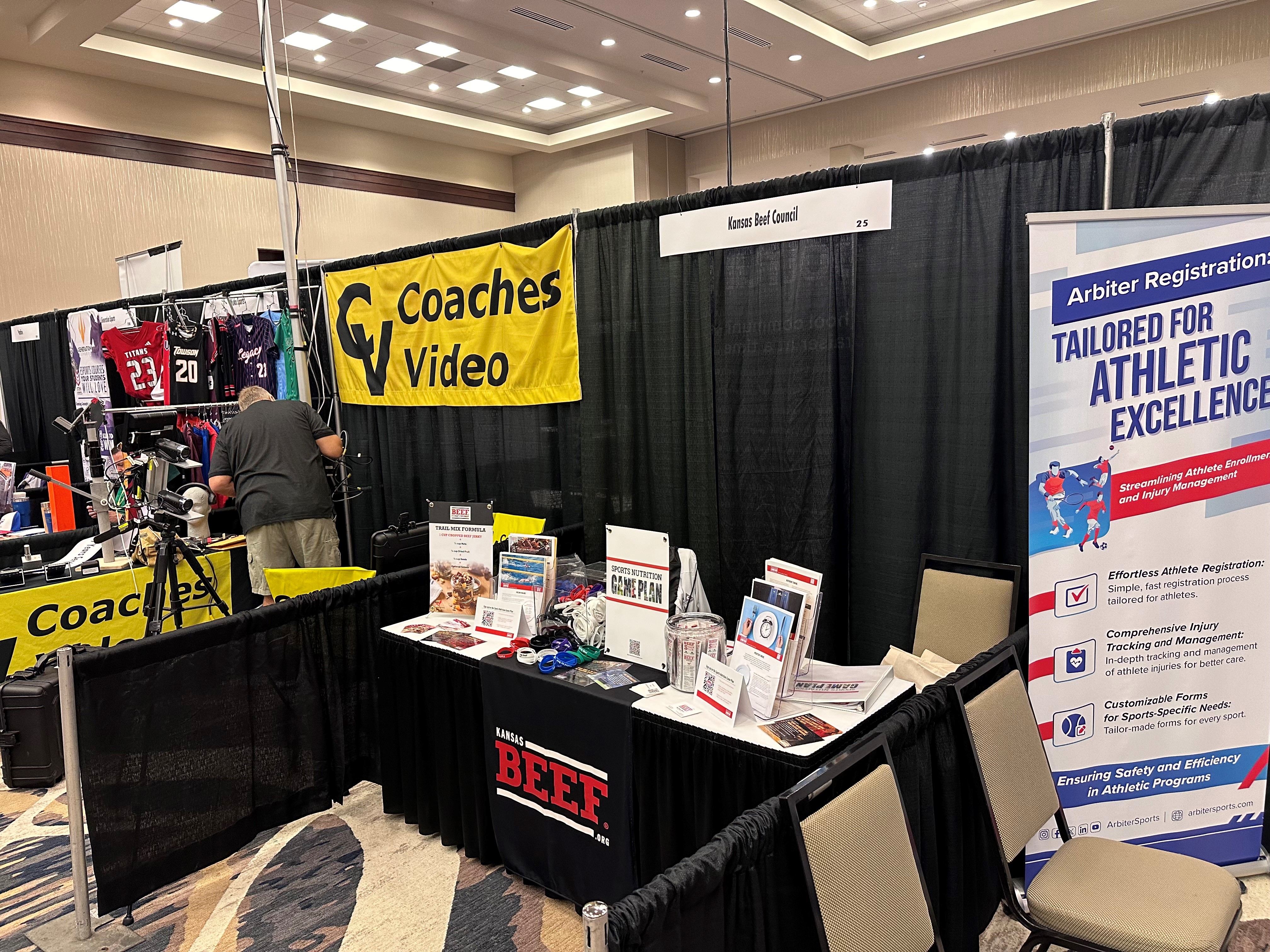 a3d4f563-63f3-bfd4-51ac-671e6c0464f6.jpg National Fastpitch Coaches Association Coaches Clinic in booth Sports Nutrition Game Plan promotion