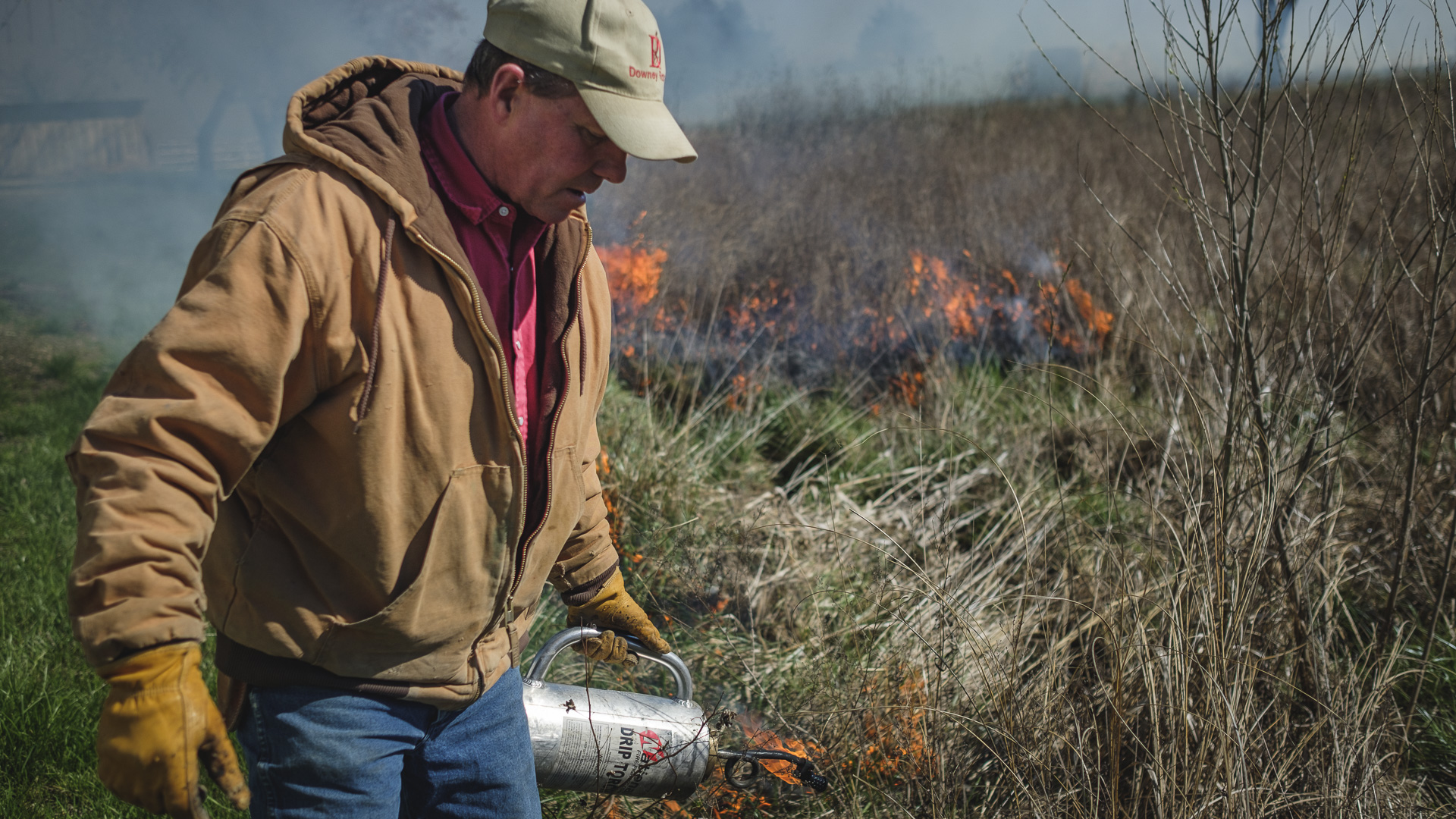 a rancher setting a back burn