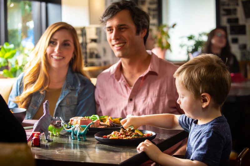 brand anthem family sitting at a table in a restaurant