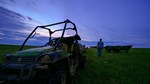 rancher with dog checking cattle