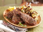 ribeye steaks and seasoned vegetable kabobs hero shot
